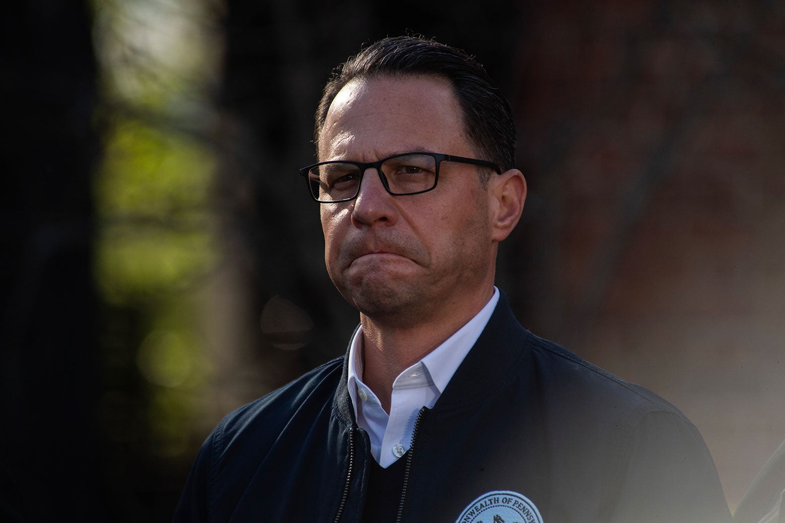 Josh Shapiro looks resolute outside his burned home.