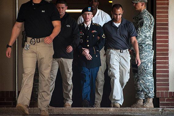 Private First Class Bradley Manning is escorted out of court after testifying in the sentencing phase of his military trial at Fort Meade, Maryland August 14, 2013.