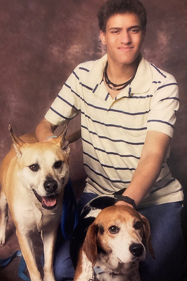 Jordan posing with his mutt Abby and beagle Jake.