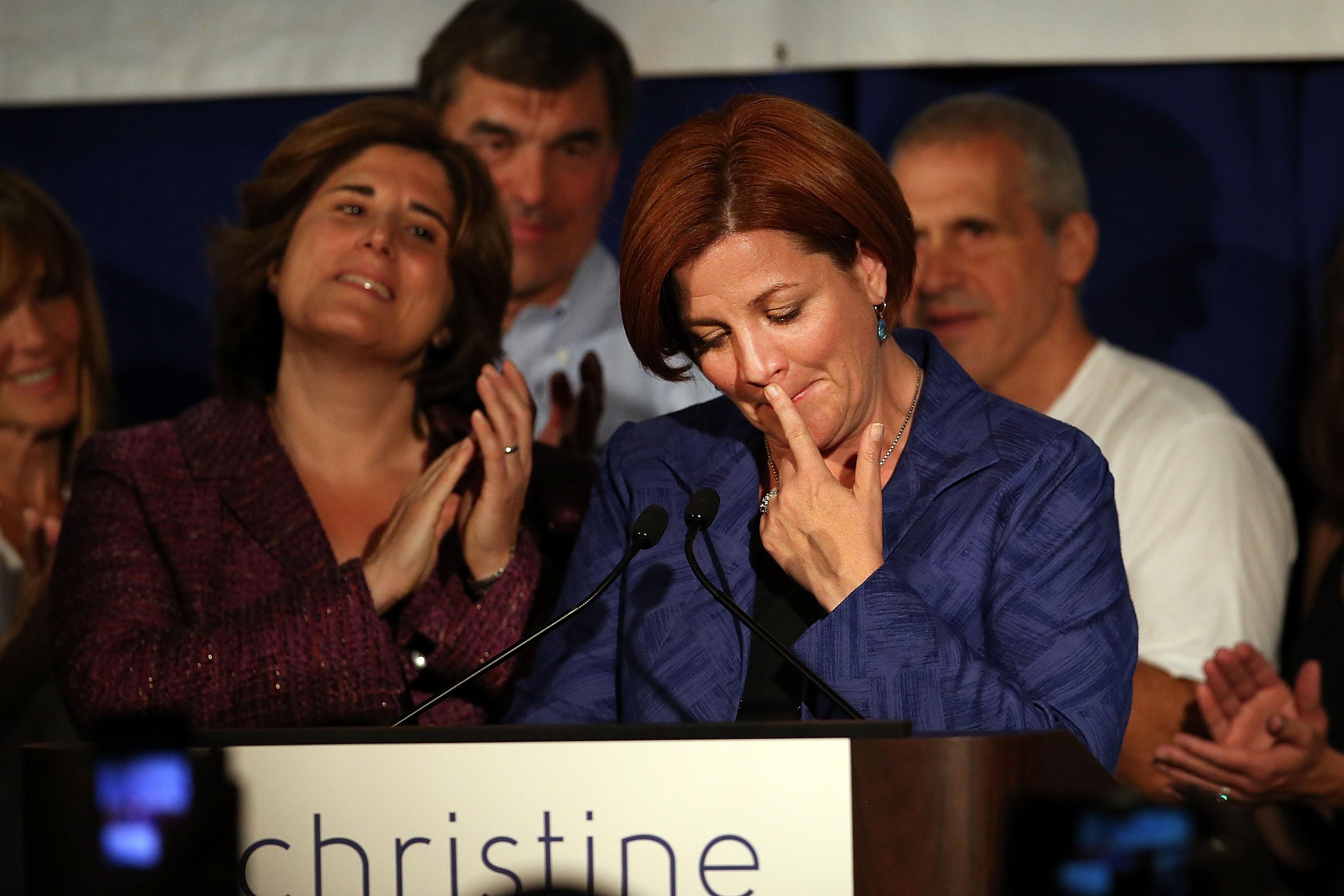 New York City Council Speaker Christine Quinn makes her concession speech. Her wife, Kim Catullo, is on her left.