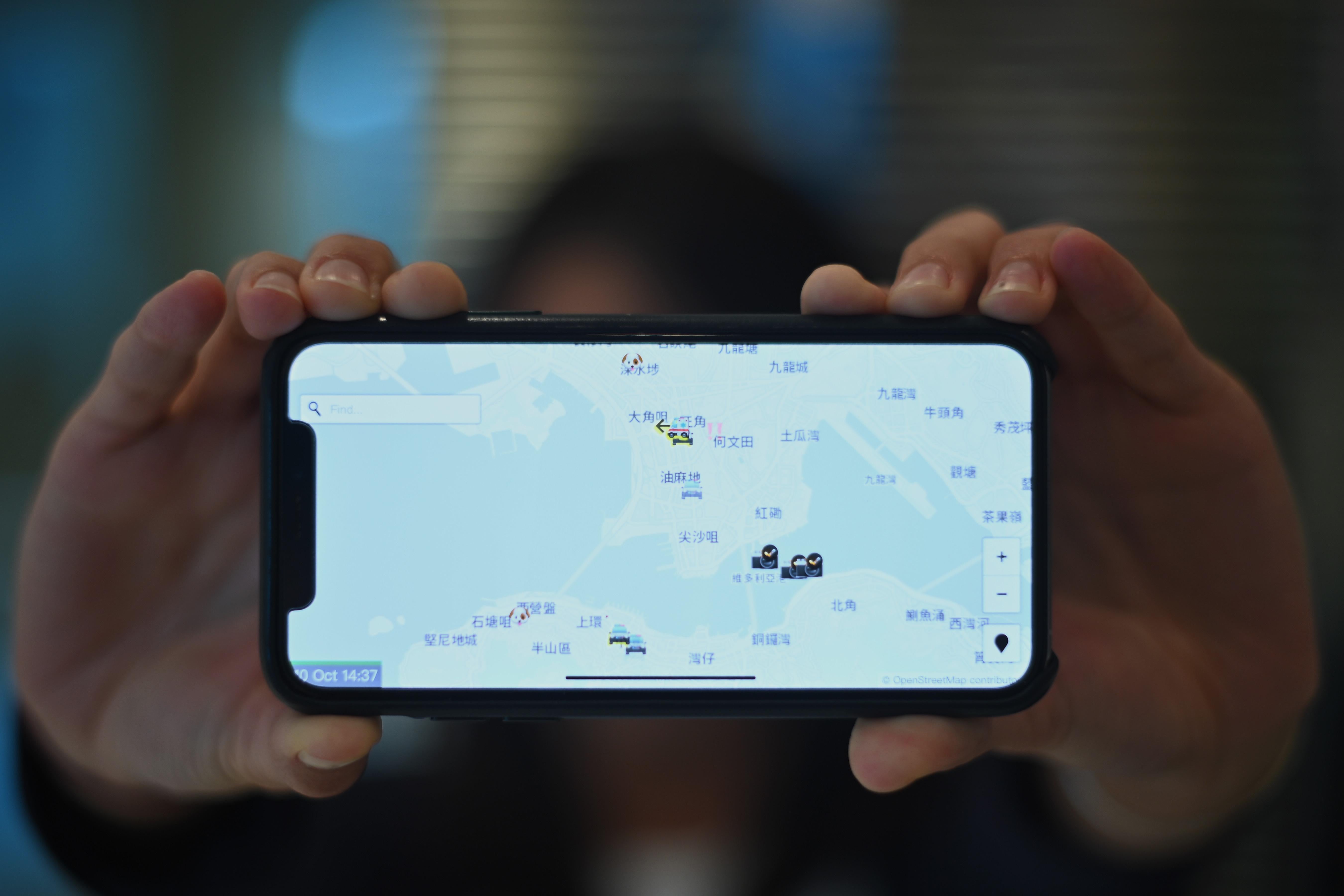 A photo illustration shows a smartphone displaying the "HKmap.live" app in Hong Kong on Oct. 10, 2019. 