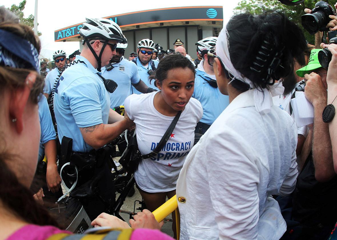Police arrest a protester as others stage a sit-in near an entrance to the Wells Fargo Center on the first day of the Democratic National Convention in Philadelphia, Pennsylvania, U.S., July 25, 2016.