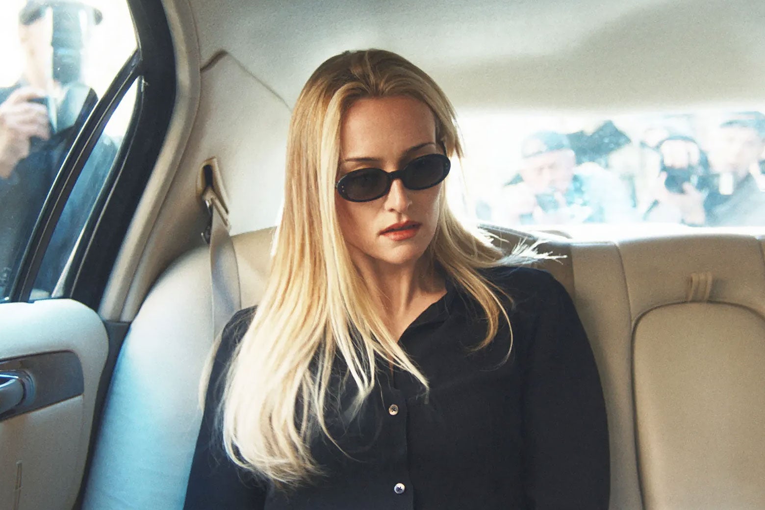  Sarah Pidgeon as Carolyn Bessette-Kennedy is in a town car wearing sunglasses in Love Story.