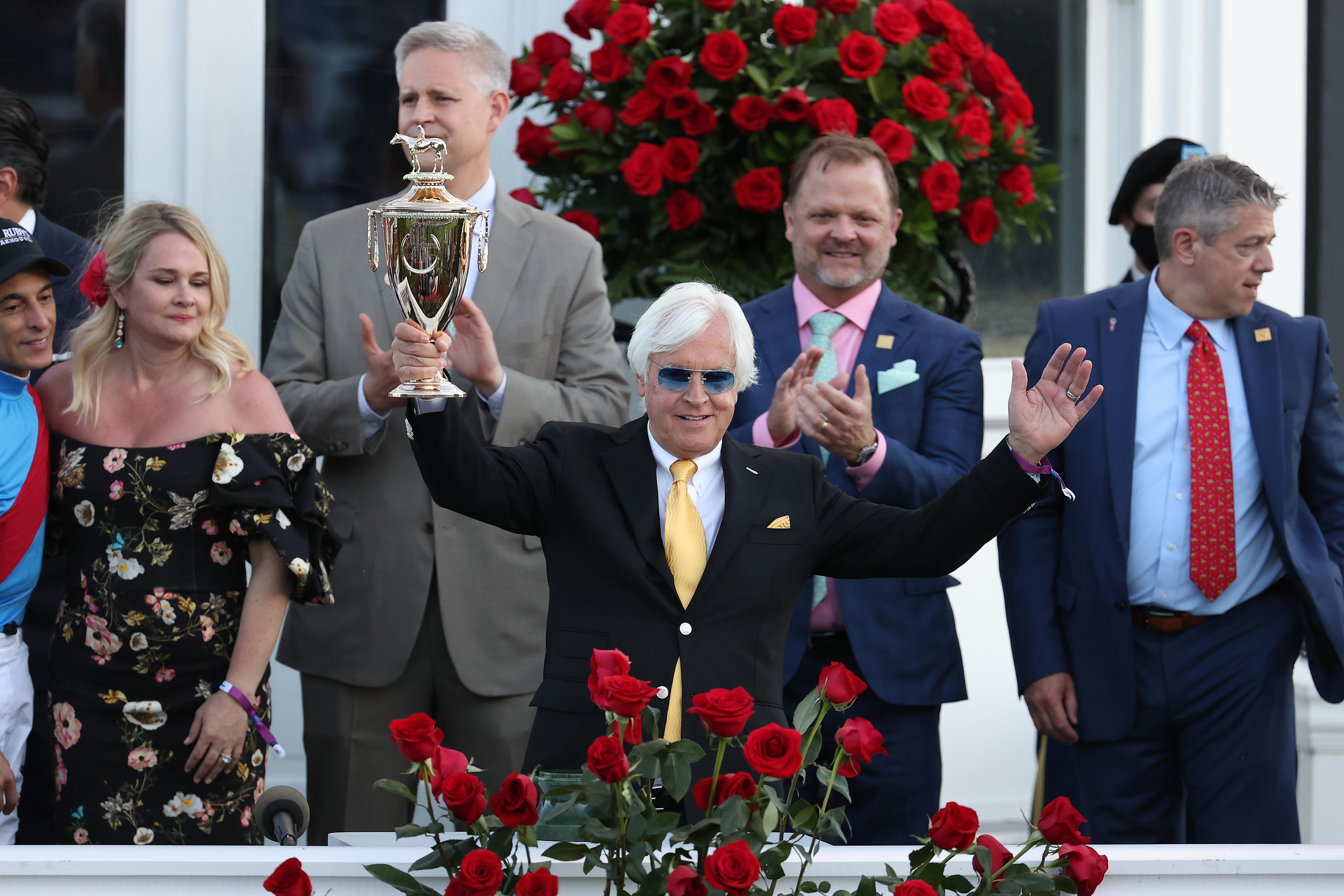 Trainer Bob Baffert raises the trophy after winning the 147th running of the Kentucky Derby with Medina Spirit, his seventh career Kentucky Derby win, at Churchill Downs on May 1, 2021 in Louisville, Kentucky.