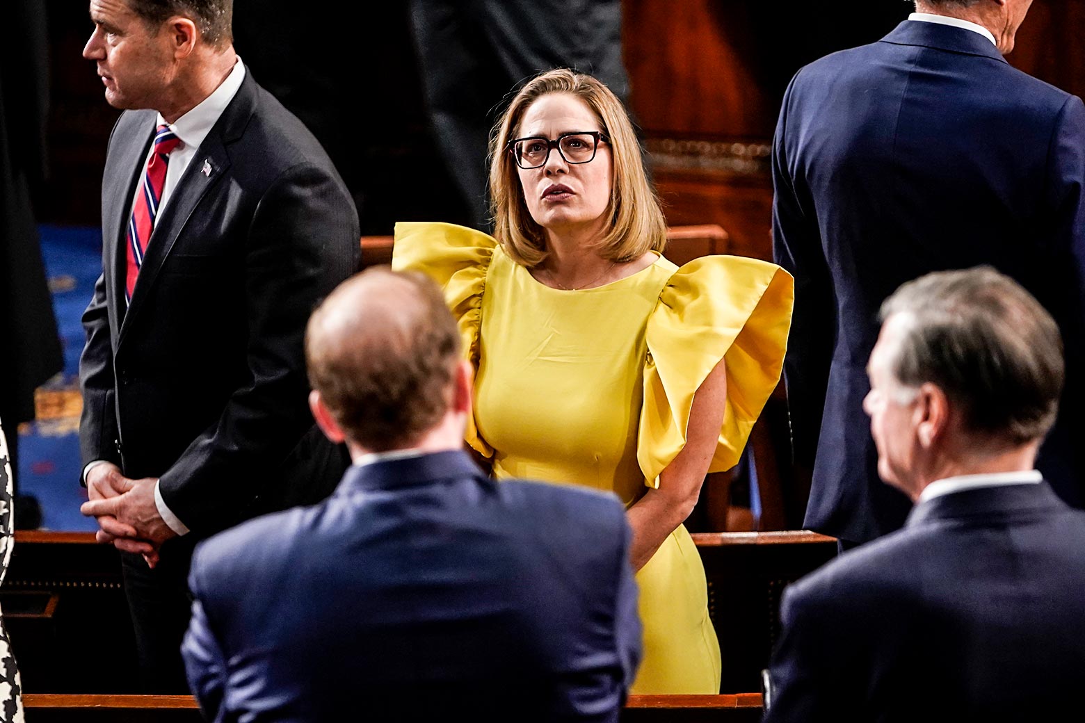 A woman in a loud, yellow dress.