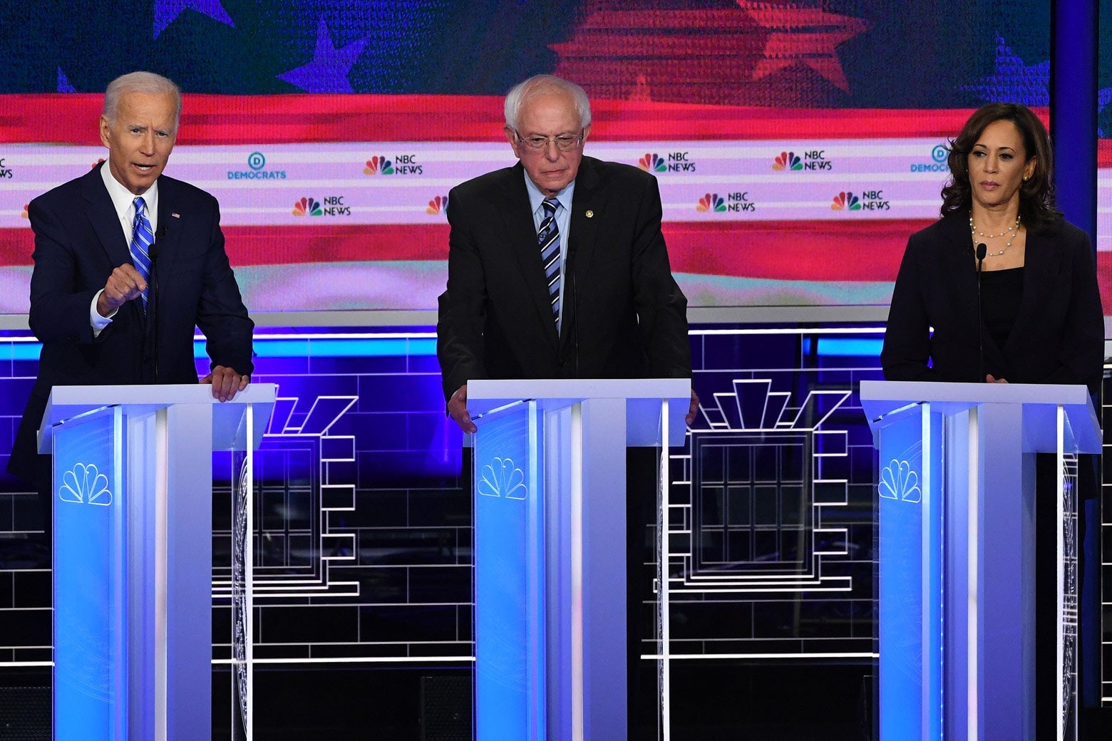 Biden, Sanders, and Harris on the debate stage.