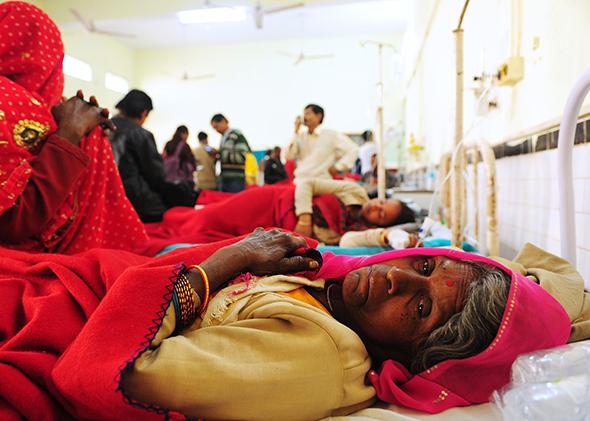 Bittan Devi, a Hindu devotee injured during an overnight stampede at the main railway station, receives treatment at a hospital in Allahabad, India, on Feb. 11, 2013.
