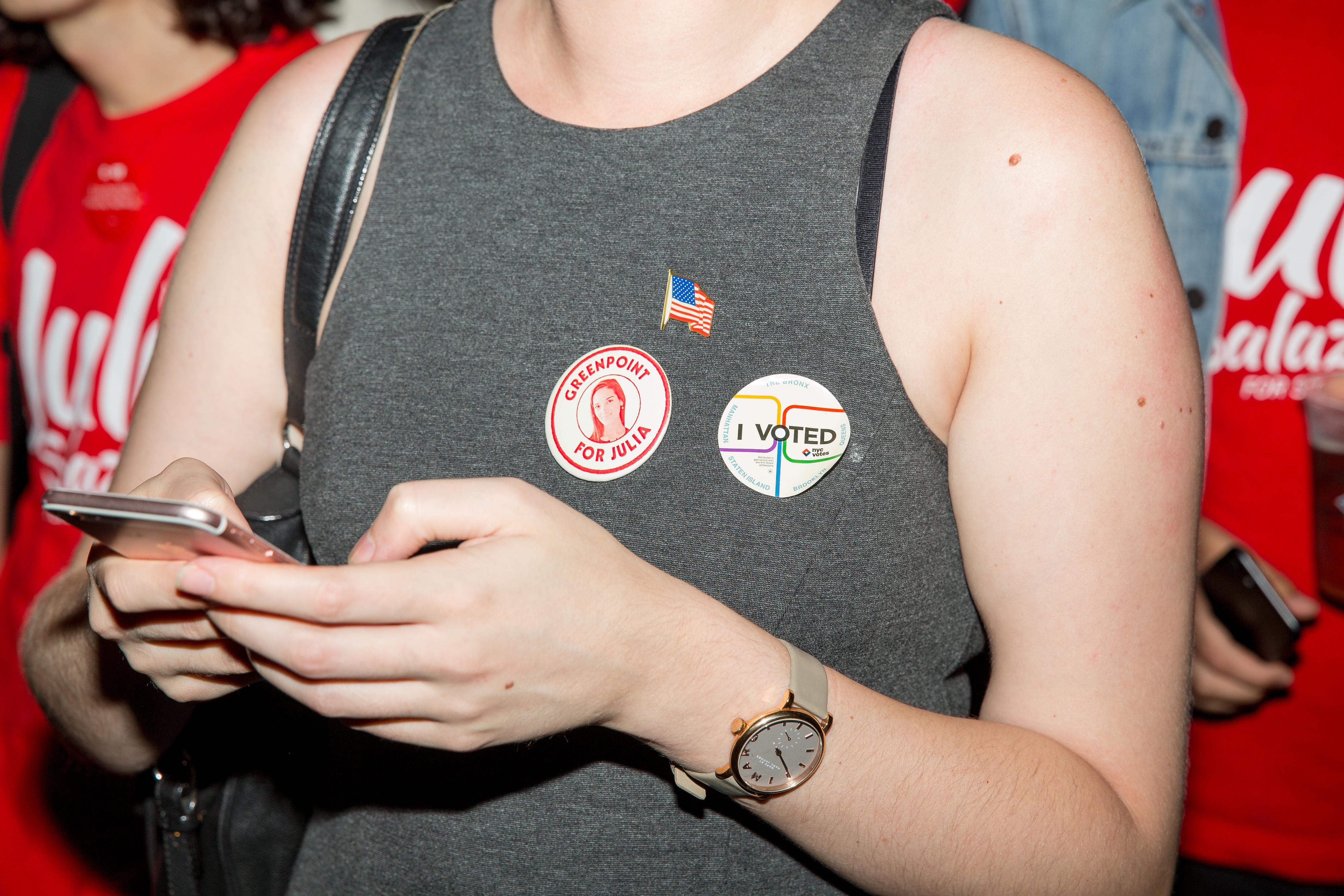 A supporter of the Democratic Socialist candidate Julia Salazar wears stickers on her shirt on the night of the New York State Primary moments before Salazar defeated incumbent Democrat State Senator Marty Dilan on September 13, 2018 in New York City.