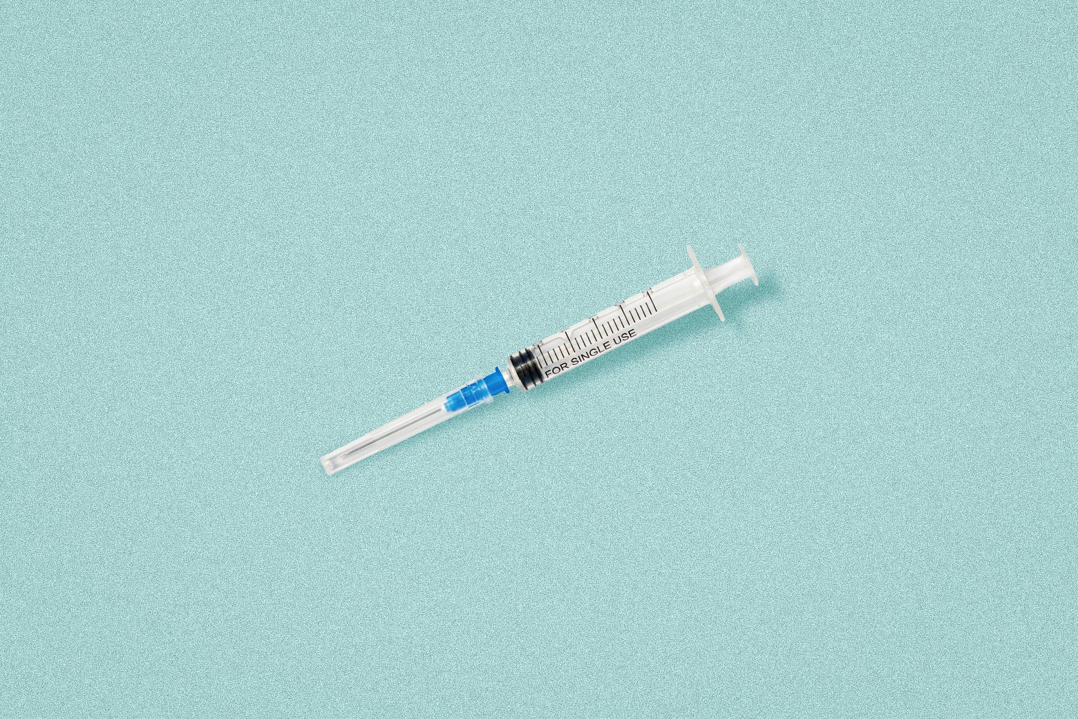 A new, packaged syringe against a calm blue background. 