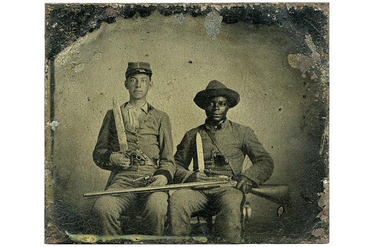 Library of Congress Prints and Photographs Division. Sergeant A.M. Chandler of the 44th Mississippi Infantry Regiment, Co. F., and Silas Chandler, family slave, with Bowie knives, revolvers, pepper-box, shotgun, and canteen