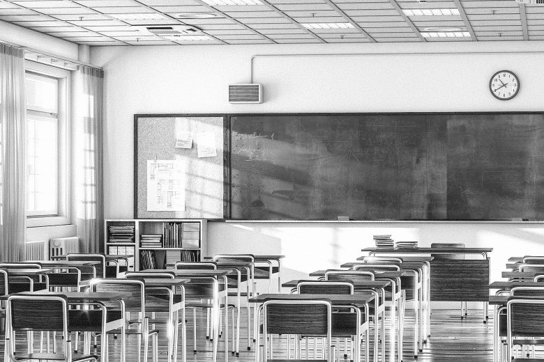 An empty classroom in black and white