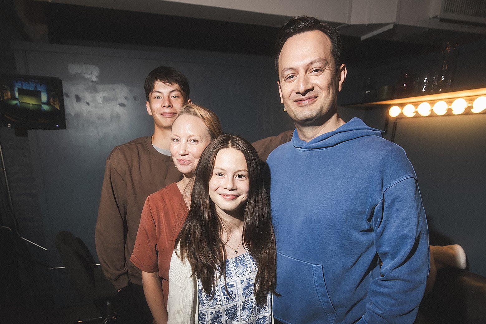 Michael Cruz Kayne backstage at a comedy show with his wife, son and daughter.