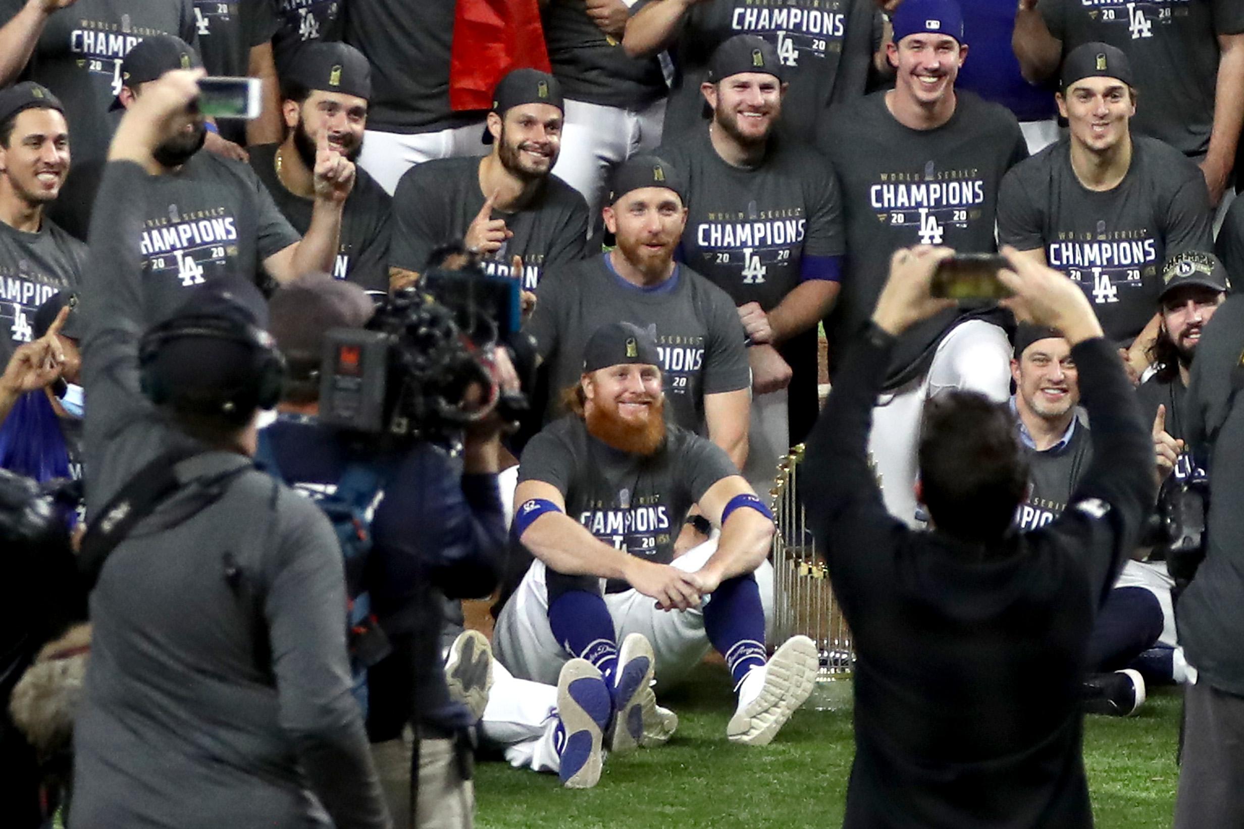  Justin Turner #10 and the Los Angeles Dodgers pose for a photo after defeating the Tampa Bay Rays 3-1 in Game 6 to win the 2020 MLB World Series.