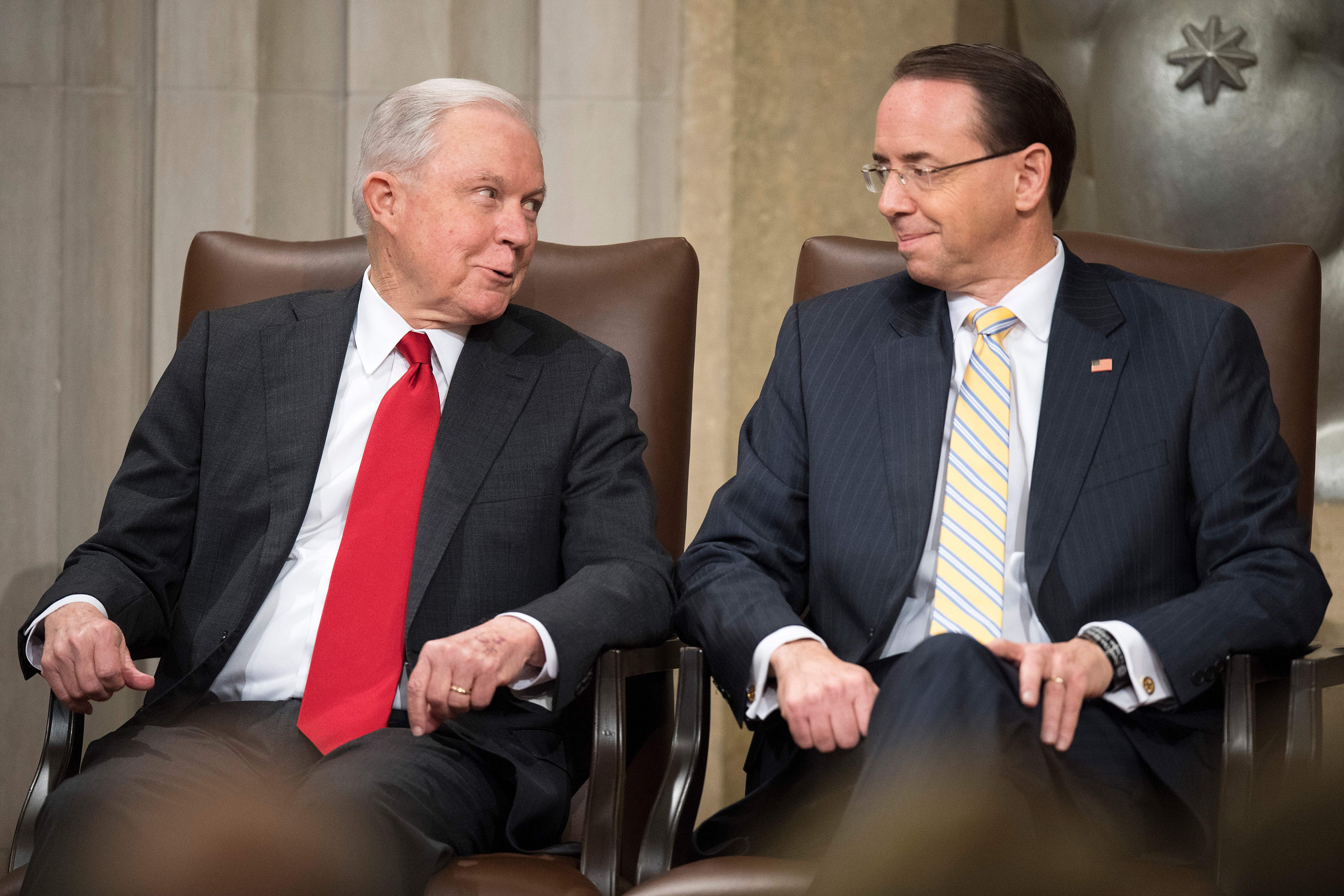 Jeff Sessions and Rod Rosenstein seated next to each other at an awards ceremony.