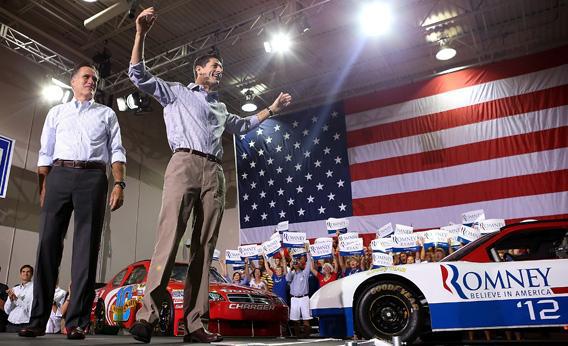 Mitt Romney, left, and running mate Rep. Paul Ryan (R-WI) greet supporers during a campaign rally.