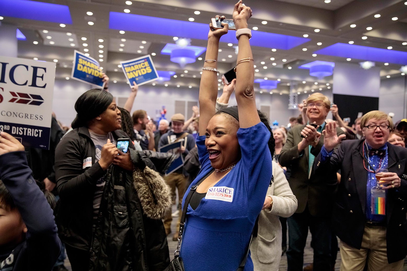 Supporters of Democratic candidate for Kansas' 3rd Congressional District Sharice Davids react to election results during a watch party on Nov. 6, 2018 in Olathe, Kansas.