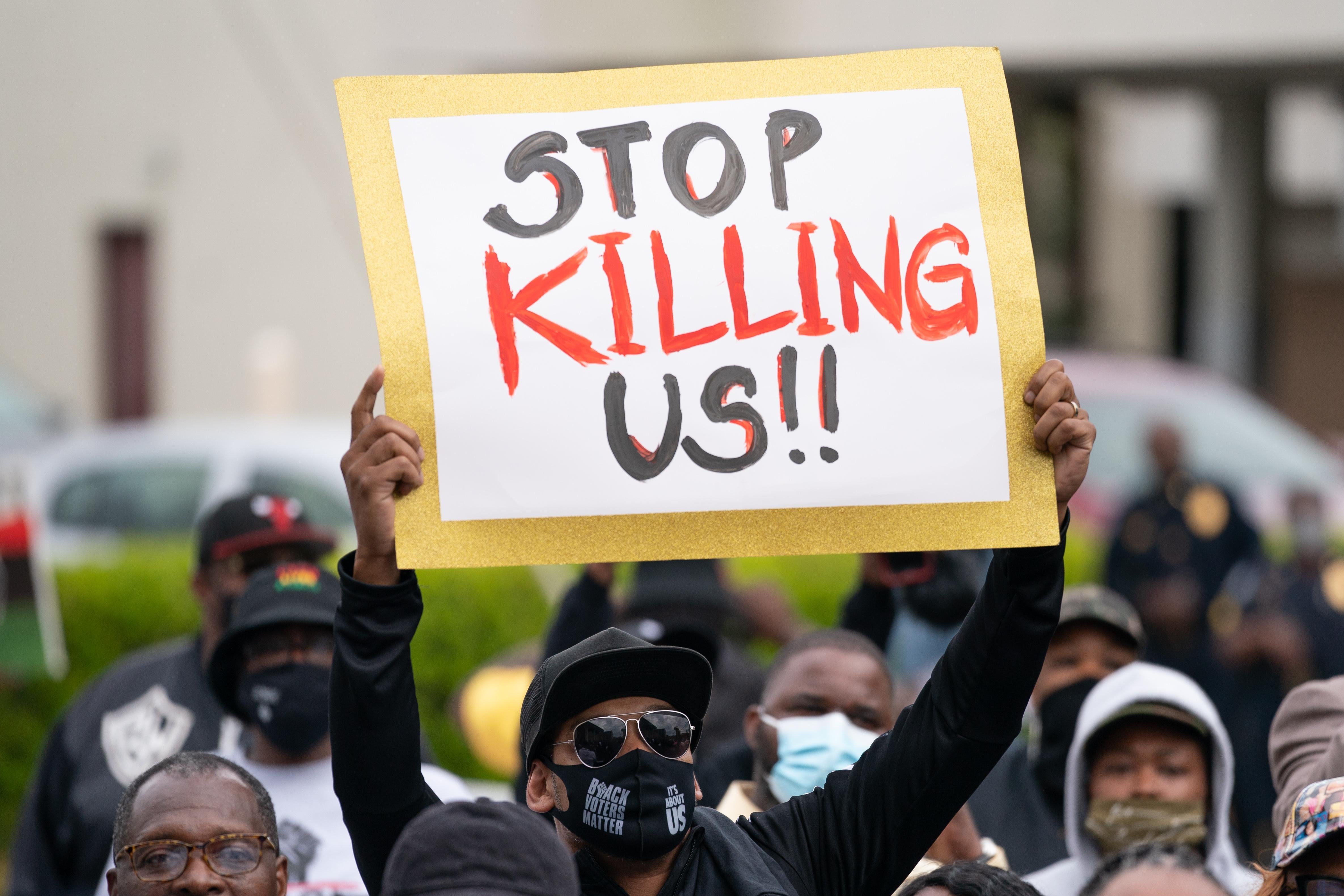 Demonstrators gather outside a government building during an emergency city council meeting April 23, 2021 in Elizabeth City, North Carolina. 