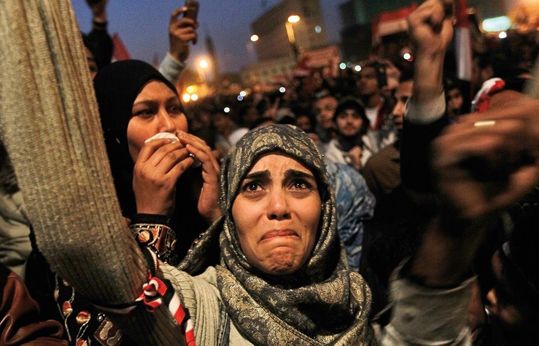 A woman cries in Tahrir Square after the announcement that former Egyptian President Hosni Mubarak was giving up power on Feb. 11, 2011, in Cairo. Hundreds of thousands of Egyptians took to the streets as news of Mubarak's resignation spread.