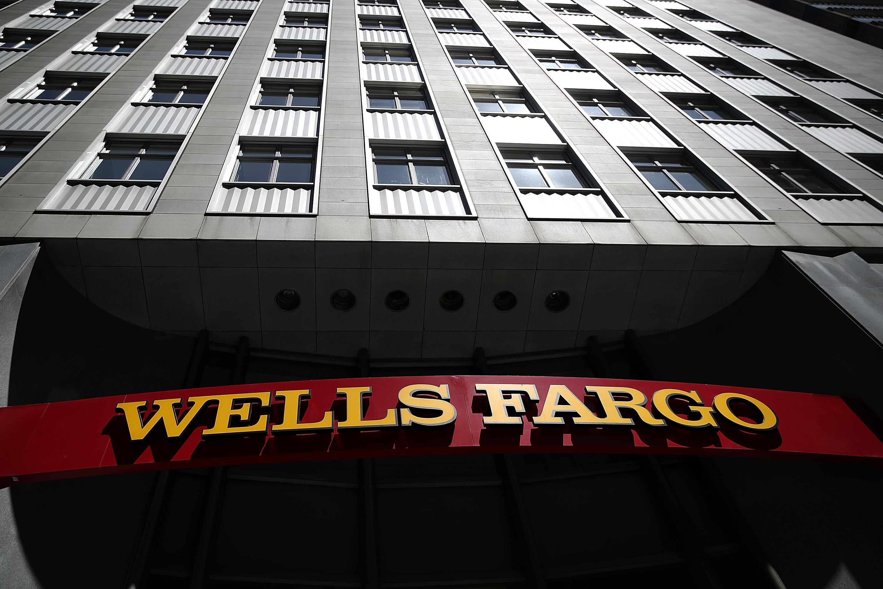 SAN FRANCISCO, CA - JULY 14:  A sign is posted at a Wells Fargo Bank branch office on July 14, 2017 in San Francisco, California. San Francisco based Wells Fargo & Co. reported better-than-expected second quarter earnings with profits up 5 percent to $5.8 billion, or $1.07 per share.  (Photo by Justin Sullivan/Getty Images)