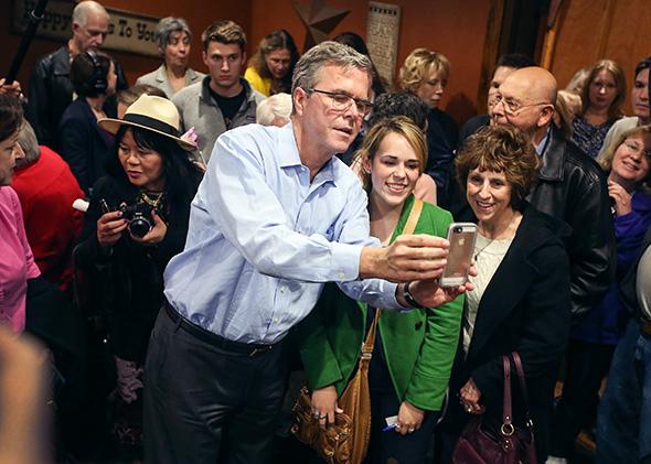 Former Florida Governor Jeb Bush campaigning and taking selfies 