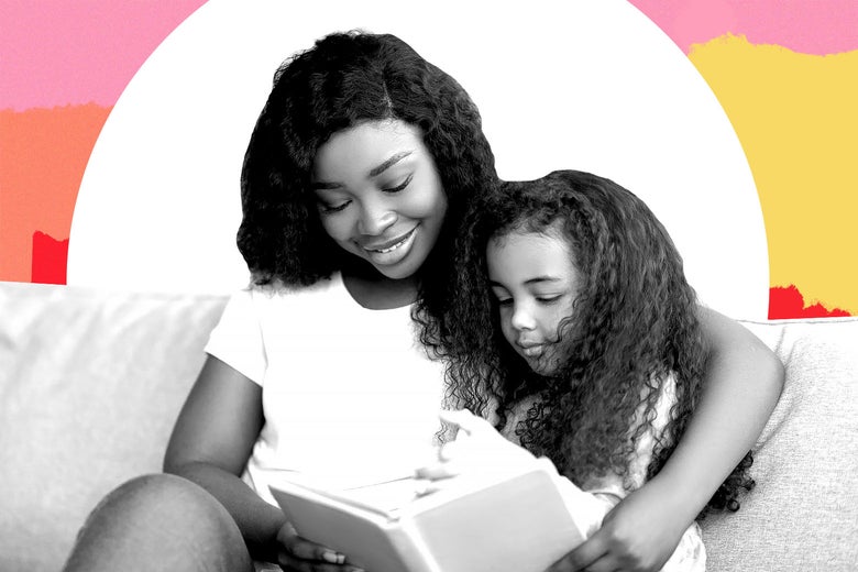 A mother reads to her young daughter.