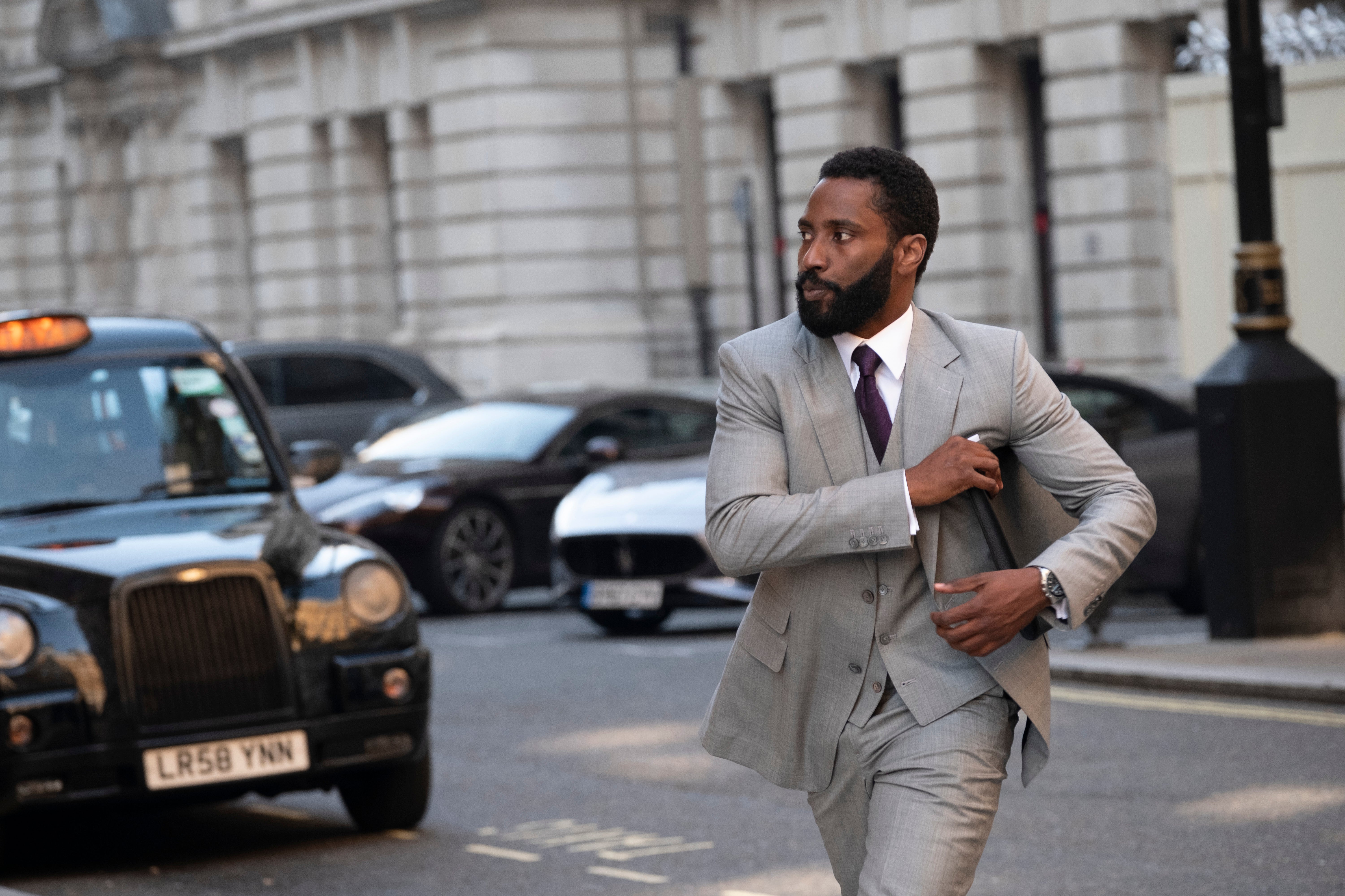 He strides confidently across the British streets, his beard neatly trimmed, his silver three piece neatly pressed.