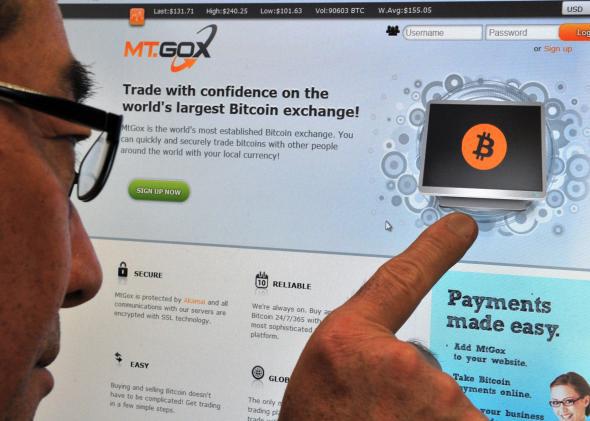 A man looking at the bitcoin exchange website of MtGox in Tokyo on February 25, 2014.