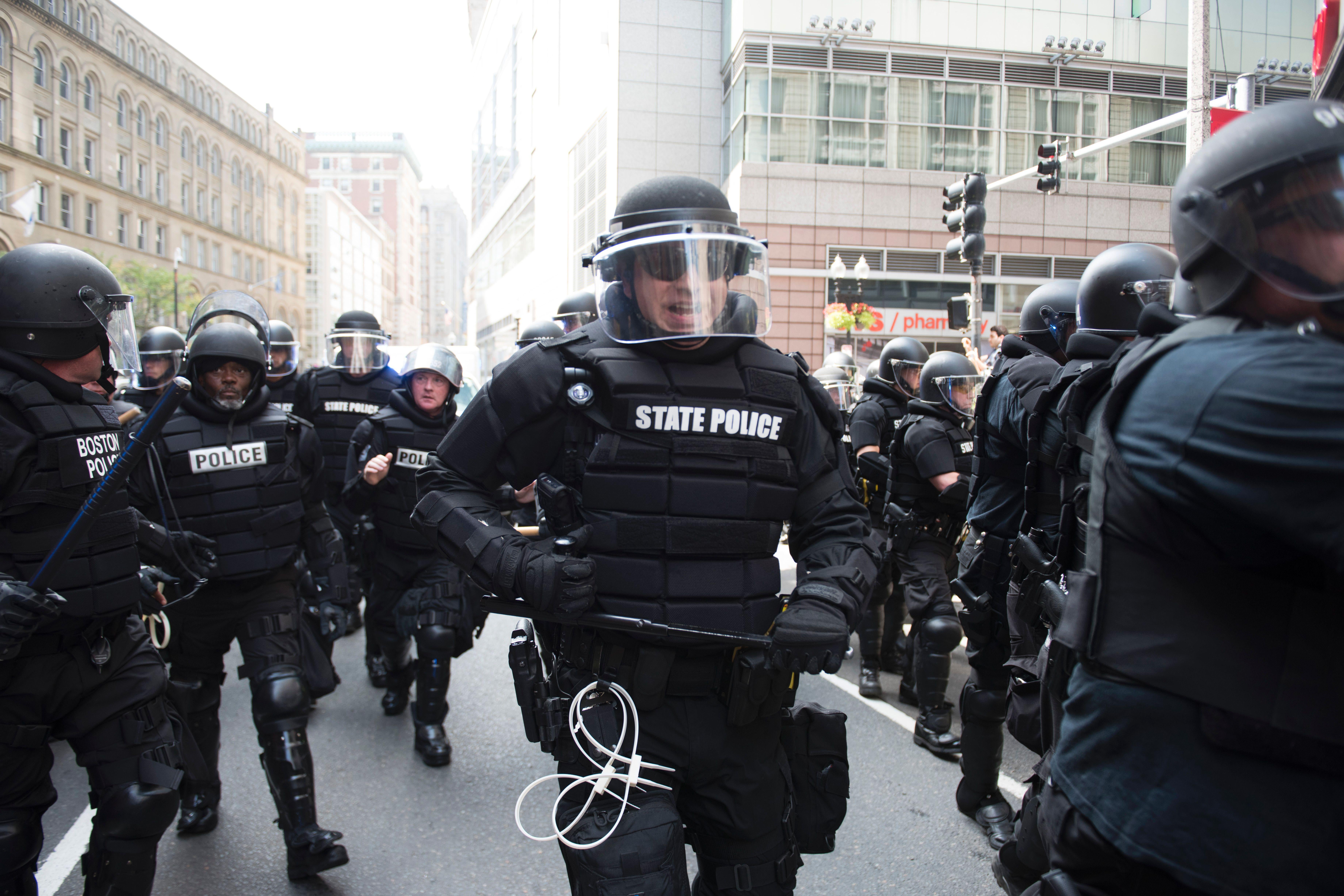 Police try to block counter-protesters of the 'Free Speech' Rally on August 19, 2017, in Boston.
Thousands of anti-racism demonstrators flooded the streets of Boston Saturday, dwarfing a gathering of white nationalists in the city, triggering scuffles with police but avoiding the serious violence that marred a similar event a week earlier in Virginia. / AFP PHOTO / Ryan McBride        (Photo credit should read RYAN MCBRIDE/AFP/Getty Images)