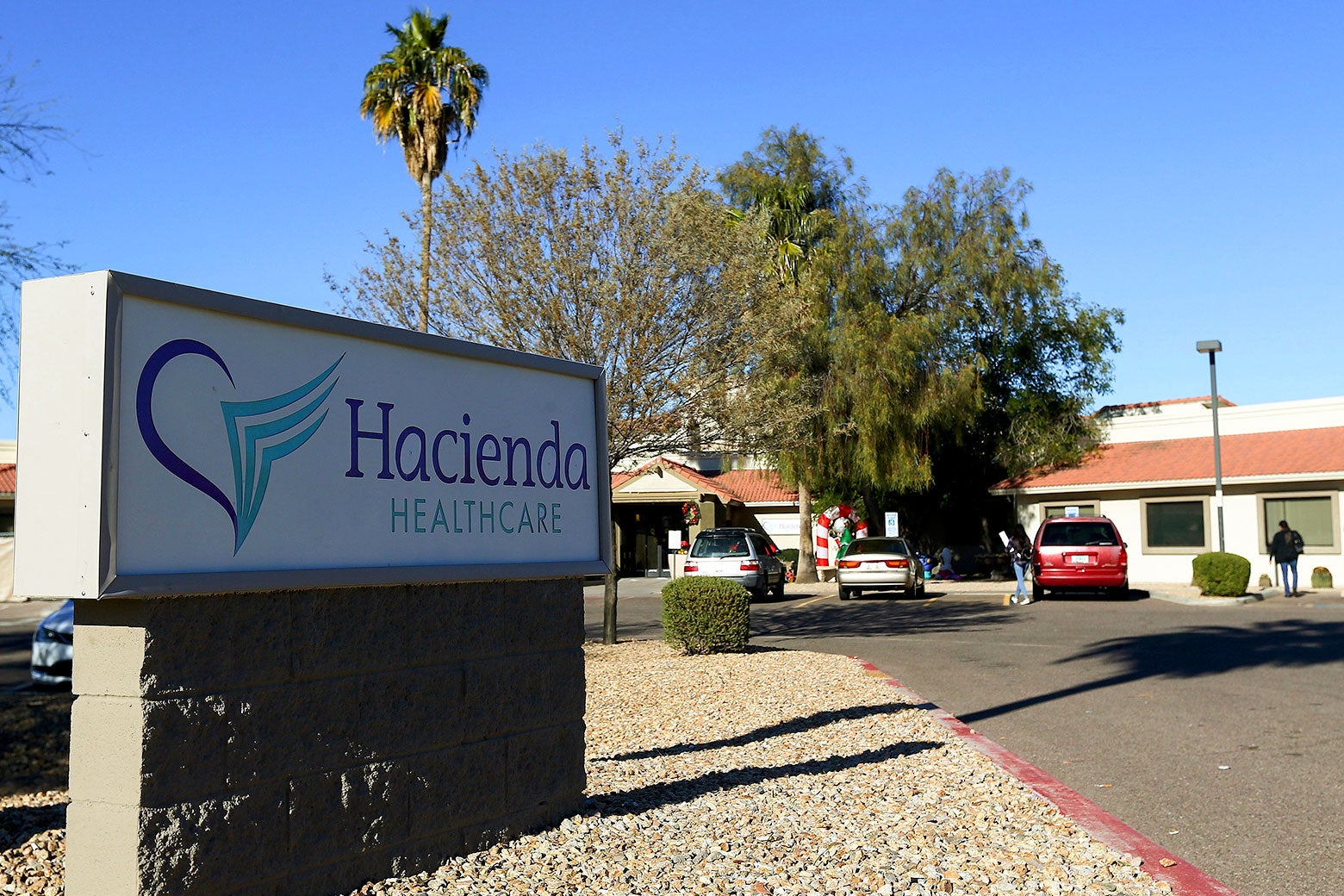 File photo of the Hacienda HealthCare sign and building in Phoenix.