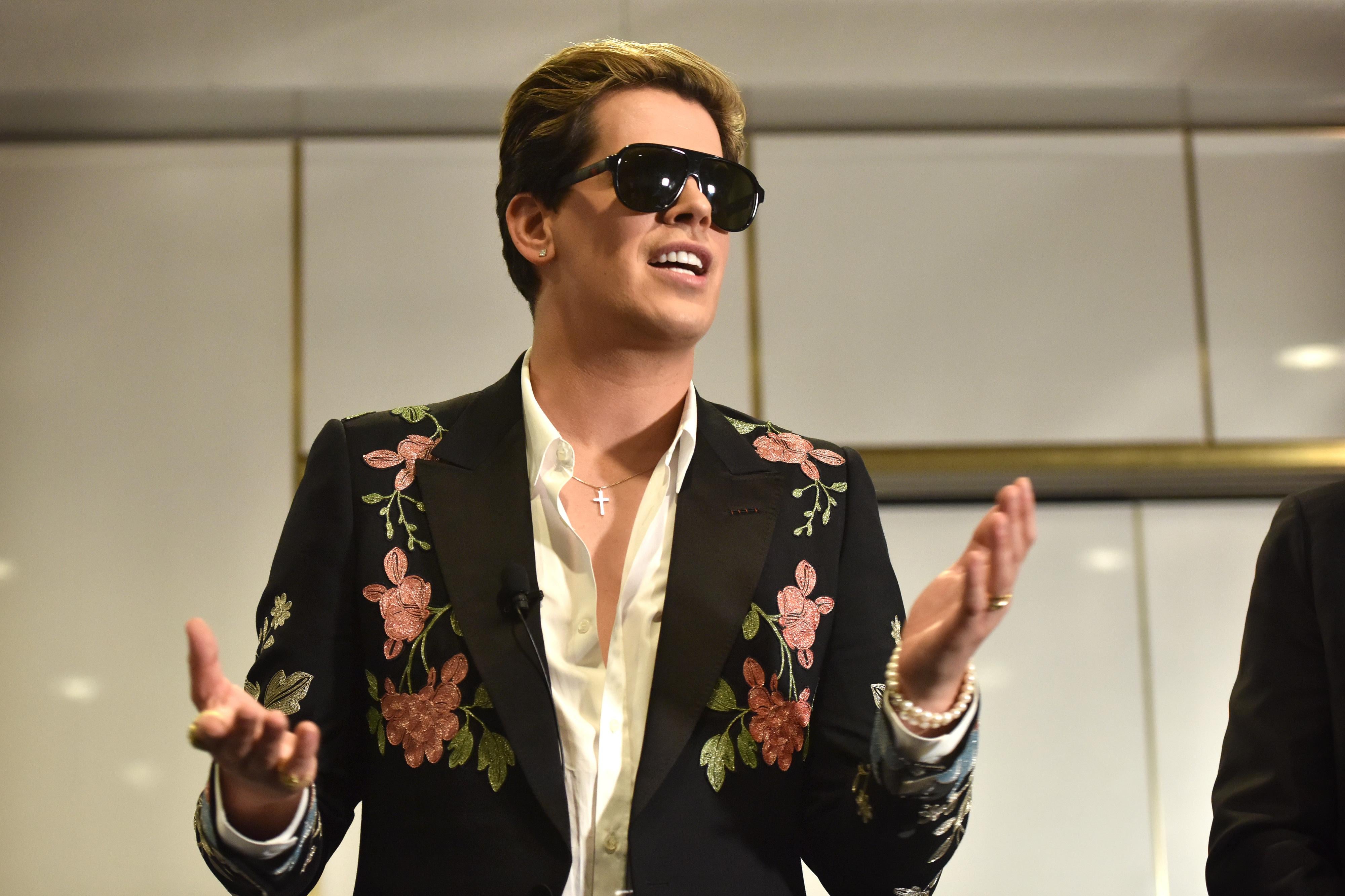 Right-wing British provocateur Milo Yiannopoulos answers questions during a speech at Parliament House in Canberra on December 5, 2017.
Yiannopoulos blasted those who do not agree with him as 'petulant babies' after violent protests in Melbourne. The polarising former Breitbart editor is touring with his 'The Troll Academy' speaking show. Hundreds of protestors clashed with police and supporters of Yiannopoulos outside a supposedly secret venue in Melbourne on December 4.
 / AFP PHOTO / MARK GRAHAM        (Photo credit should read MARK GRAHAM/AFP/Getty Images)