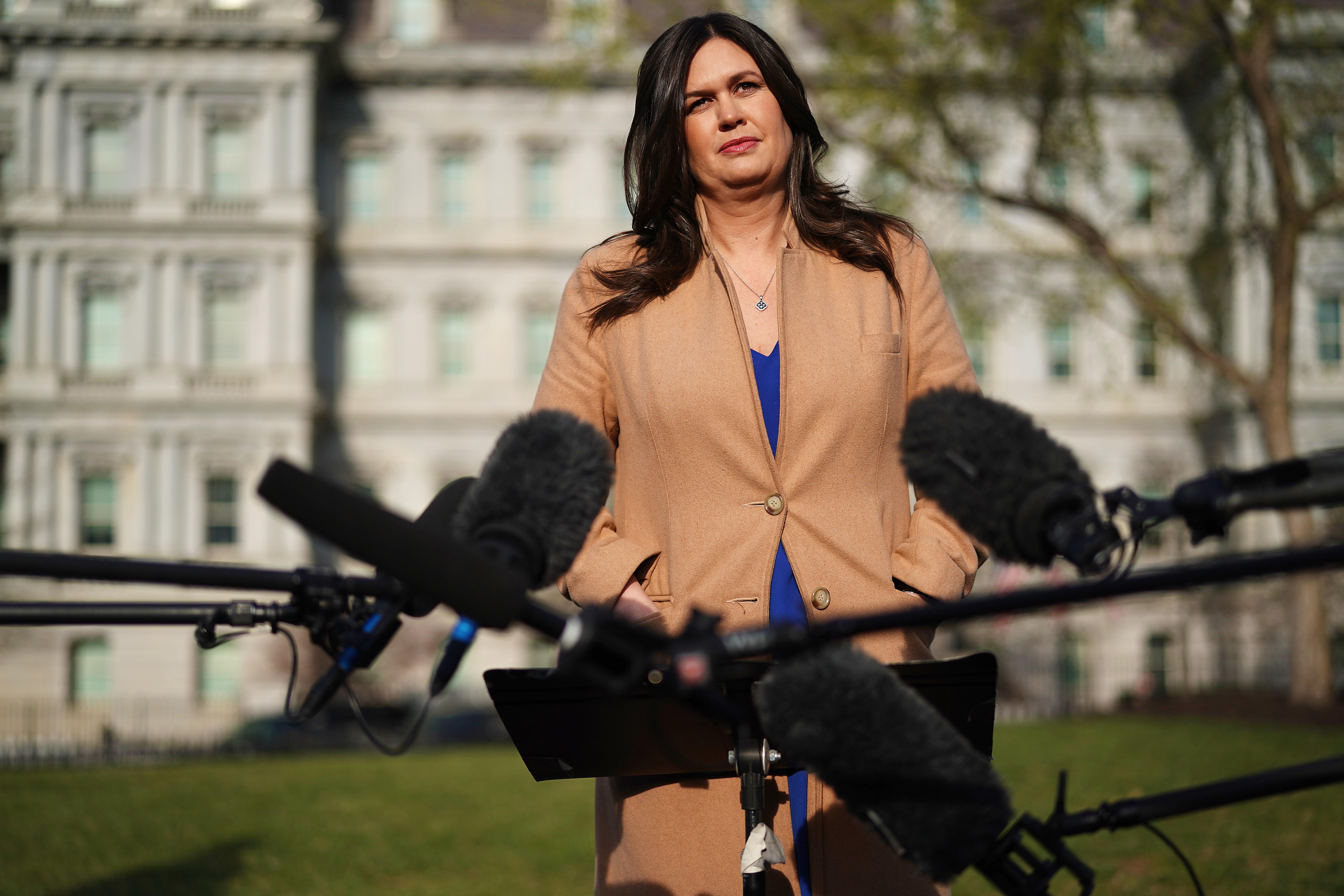 White House press secretary Sarah Huckabee Sanders talks to reporters outside the West Wing of the White House April 4, 2019 in Washington, D.C.