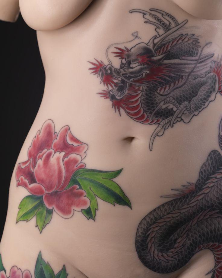 Tattoo motif designed by French tattoo artist Tin-tin on the silicone bust of a woman's body.
