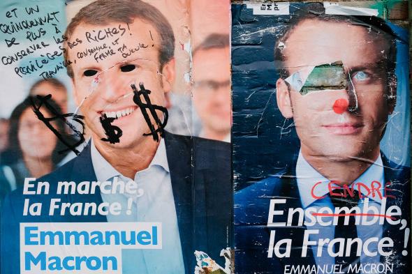 Macron vandalized poster