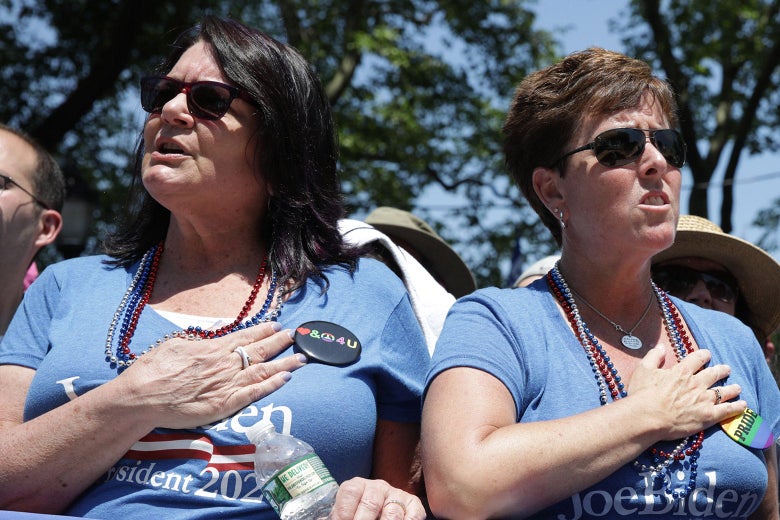 Supporters of Joe Biden with their hands over their hearts