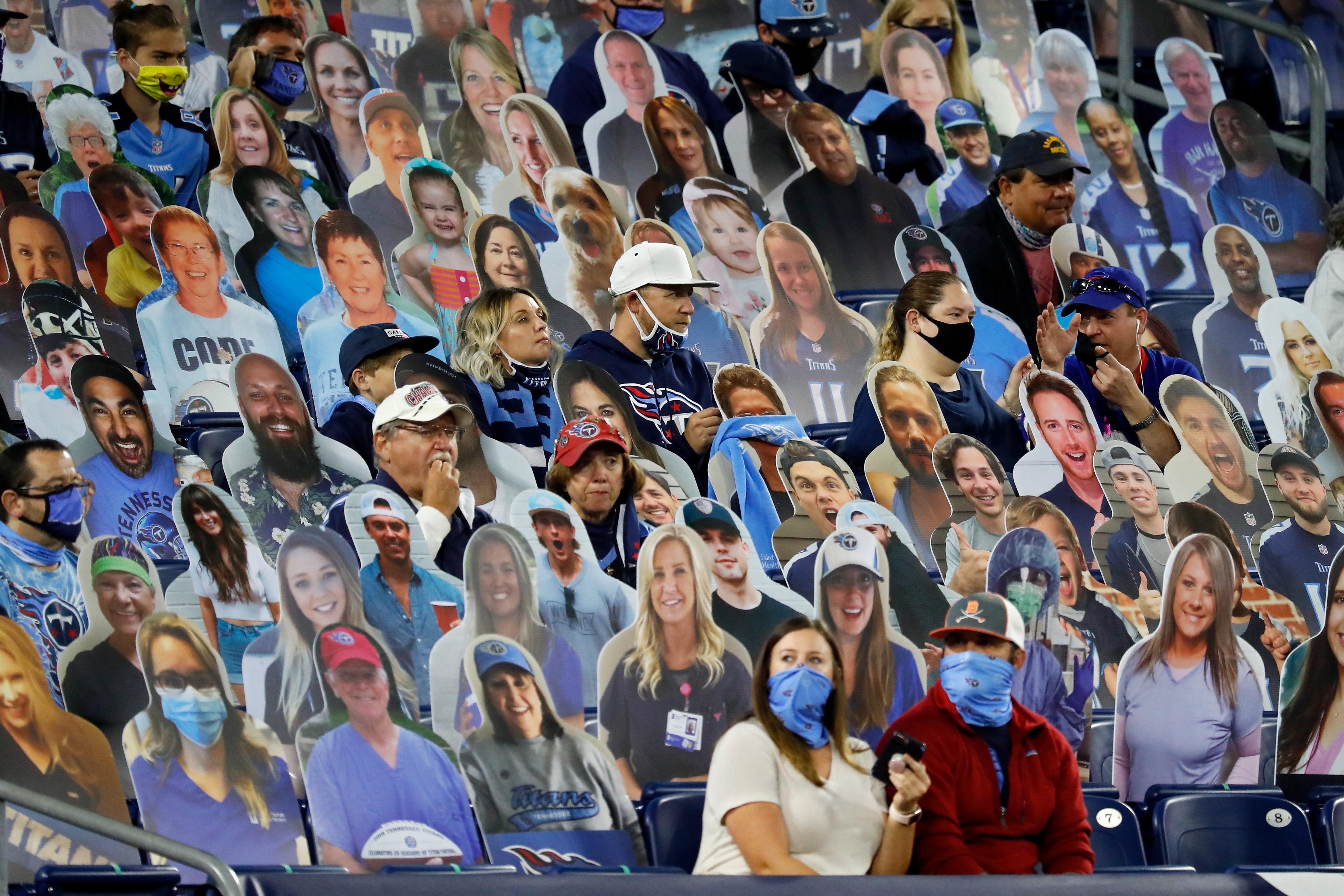 Fans sits among cardboard cutouts during the game between the Buffalo Bills and Tennessee Titans at Nissan Stadium on October 13, 2020 in Nashville, Tennessee.