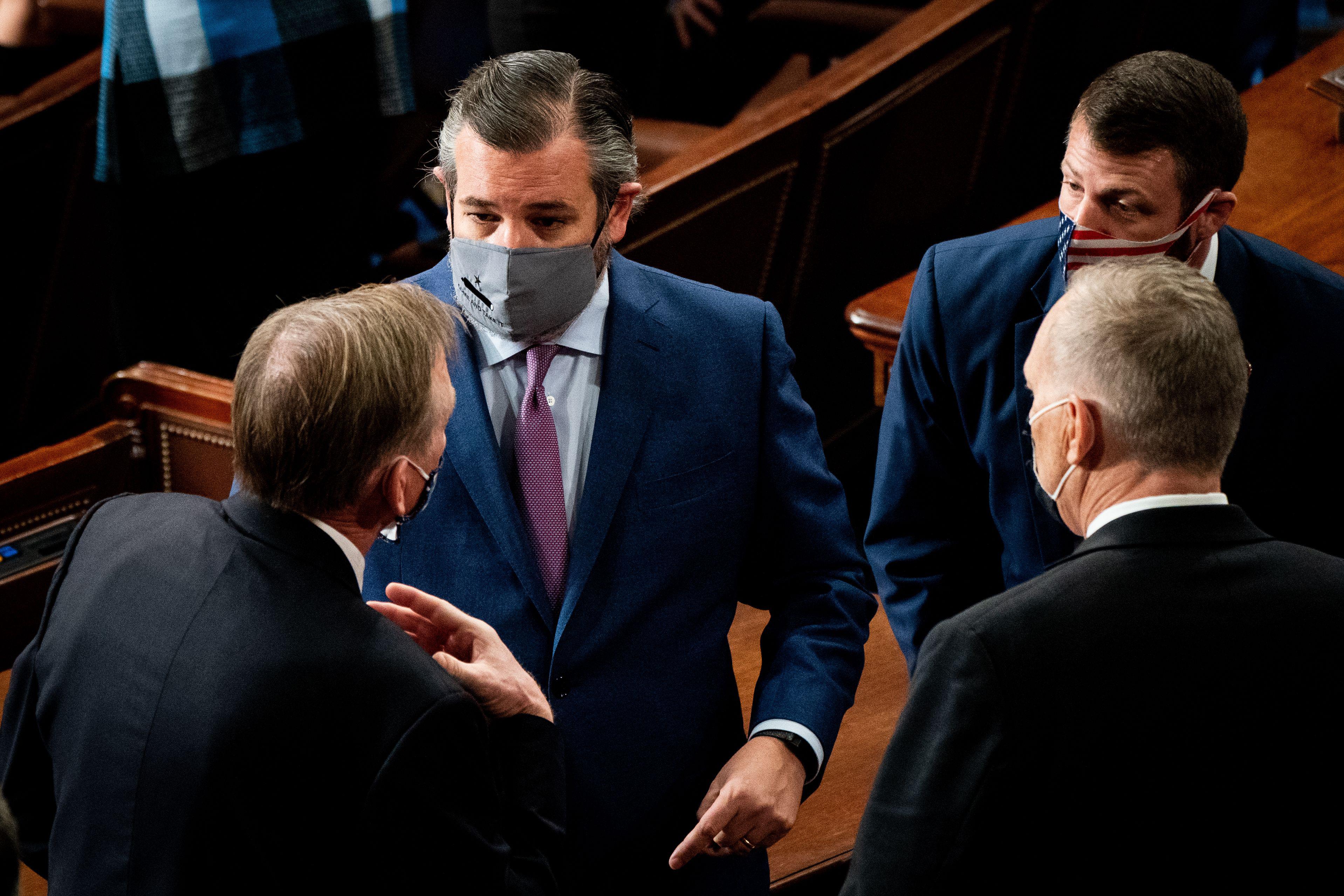 A masked Sen. Cruz chats it up.