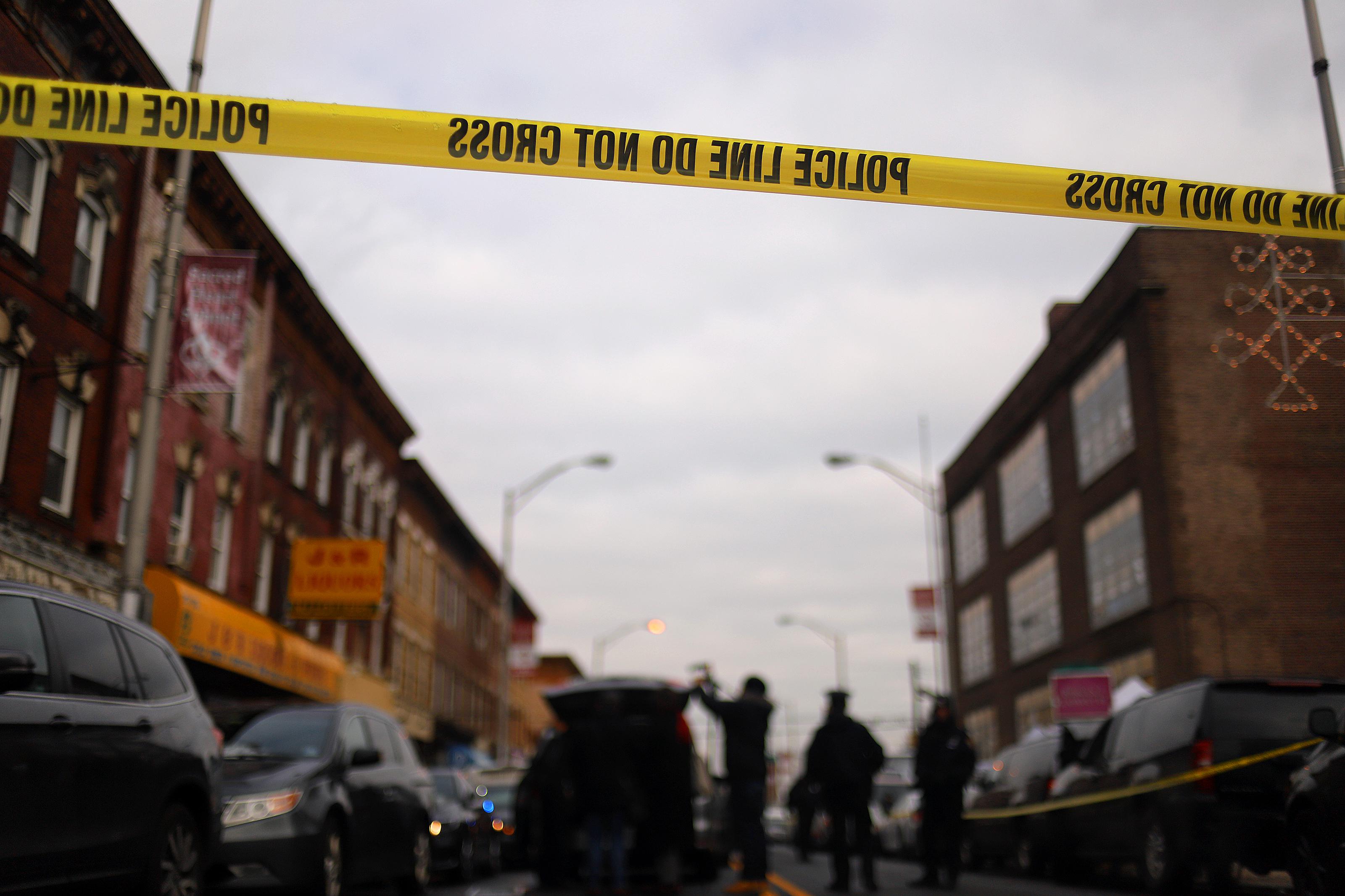 Detail of a police line band as recovery and clean up crews arrive to the JC Kosher Supermarket in the aftermath of a mass shooting on December 11, 2019 in Jersey City, New Jersey. 