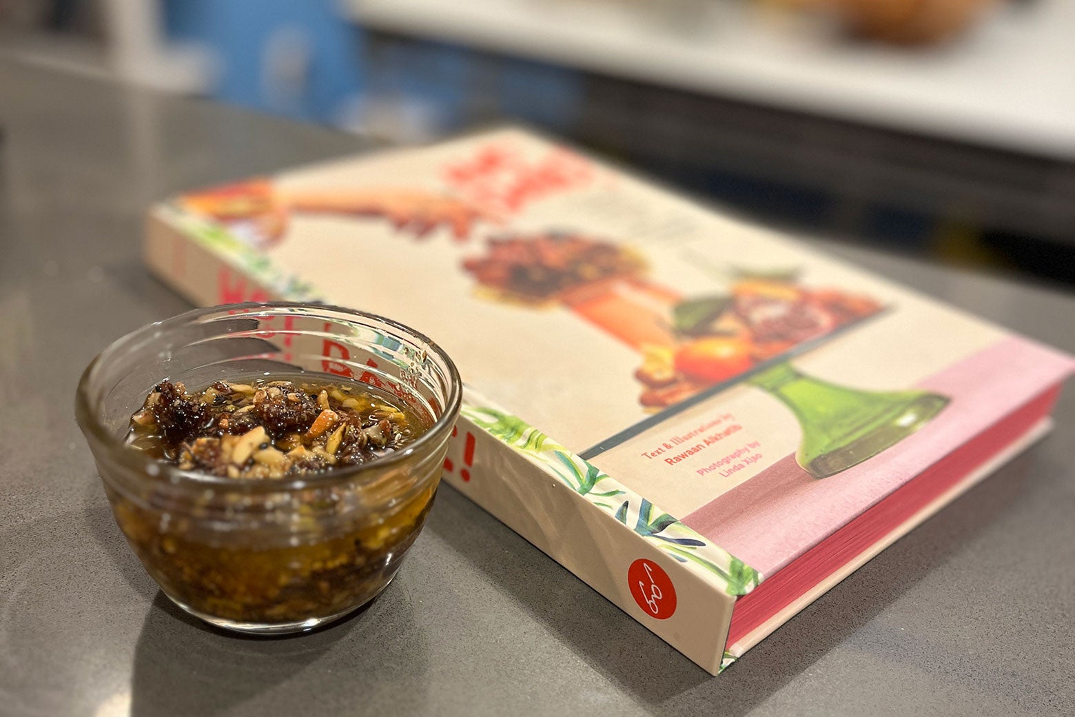 recipes A date condiment in a small glass dish in a kitchen.