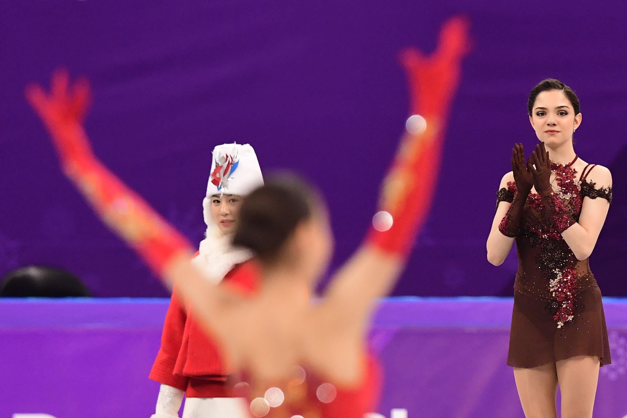 Gold medallist Russia’s Alina Zagitova celebrates (L) as silver medallist Russia’s Evgenia Medvedeva claps before the venue ceremony after the women’s single skating free skating of the figure skating event during the Pyeongchang 2018 Winter Olympic Games at the Gangneung Ice Arena in Gangneung on February 23, 2018.