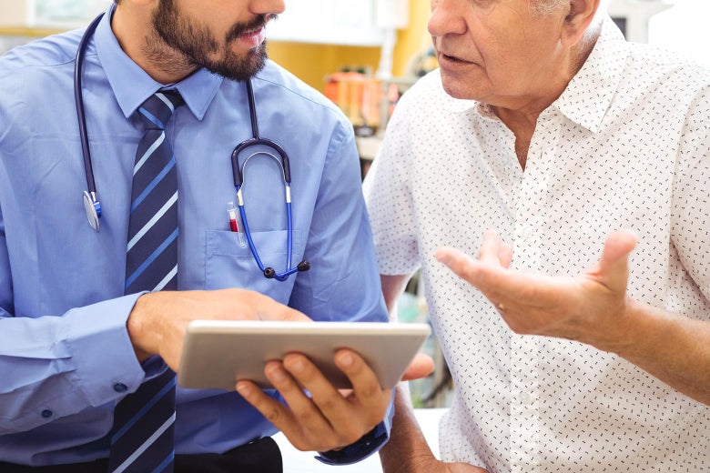 A stock photo depicts a doctor assessing a patient's needs.
