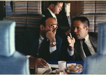 Presidential advisers, H.R. Haldeman and John D. Ehrlichman discuss policy aboard Air Force One over the Mississippi flooded area near Merideth, Mississippi, April 1973.