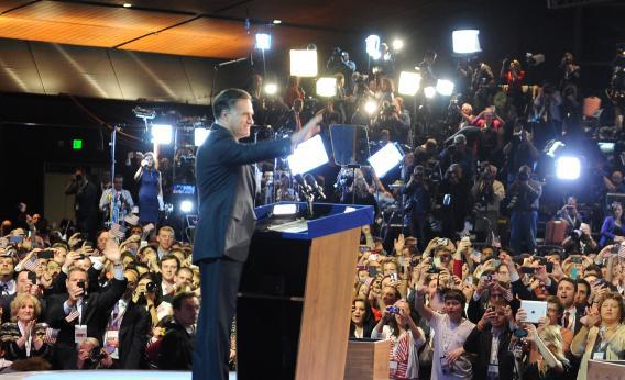 Mitt Romney greets supporters as he concedes the presidency during his campaign election.