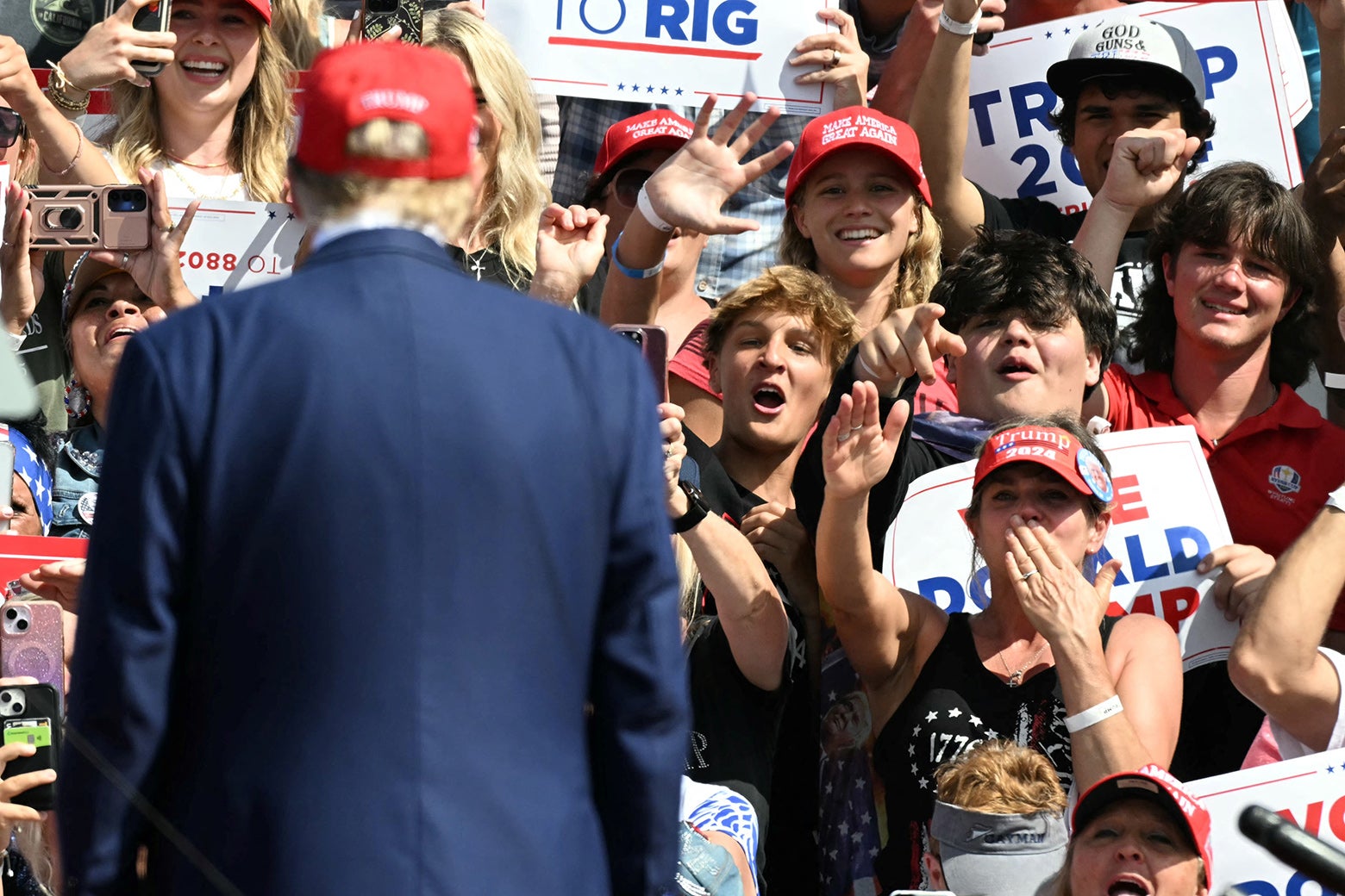 Supporters cheer as Donald Trump arrives to speak at a campaign event in Racine, Wisconsin, on June 18, 2024. 