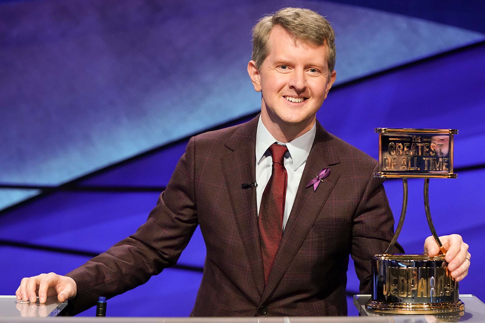 Ken Jennings with the Greatest of All Time Jeopardy trophy.