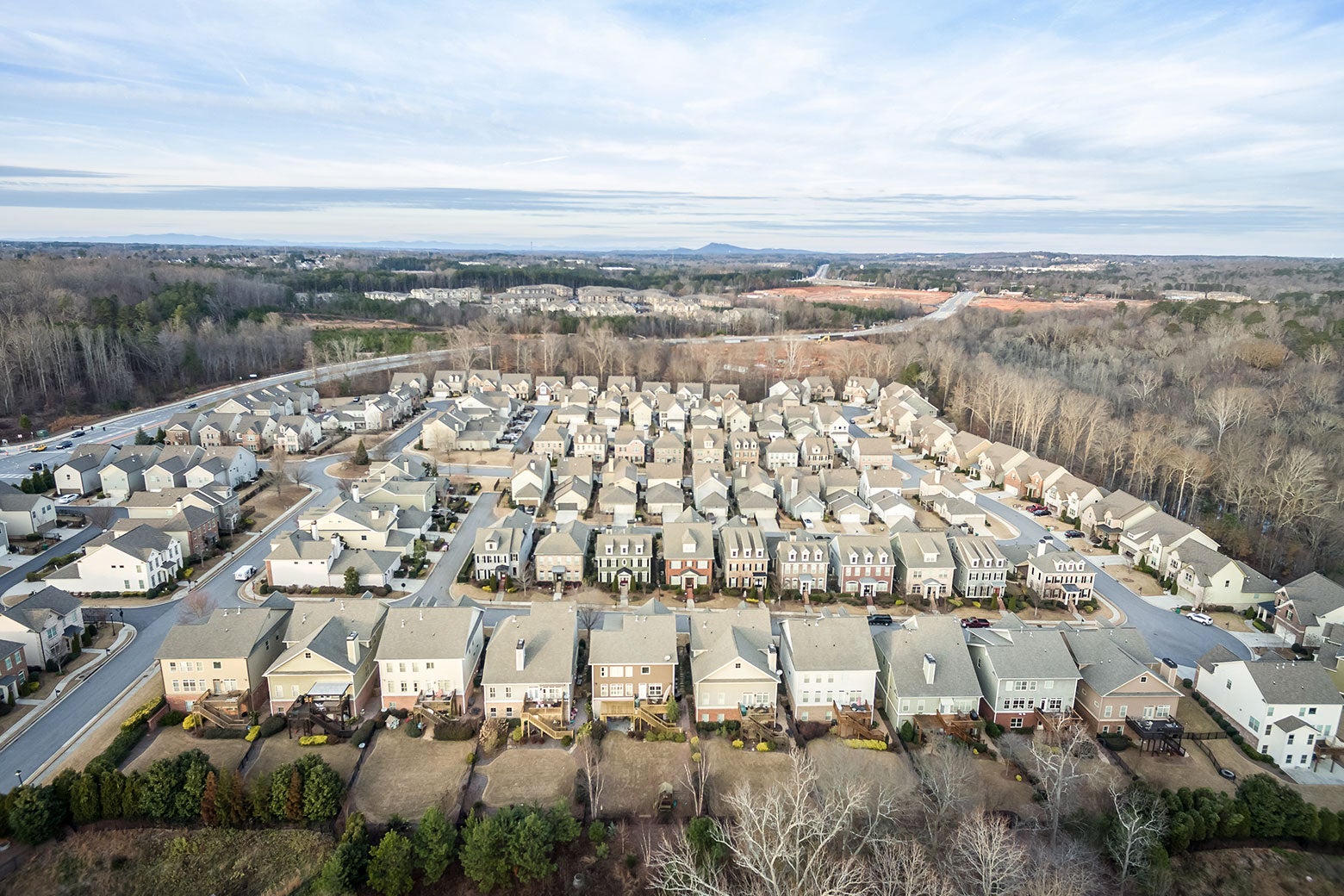 A new development seen from above is clearly odd and very square cut out of a section of forest.