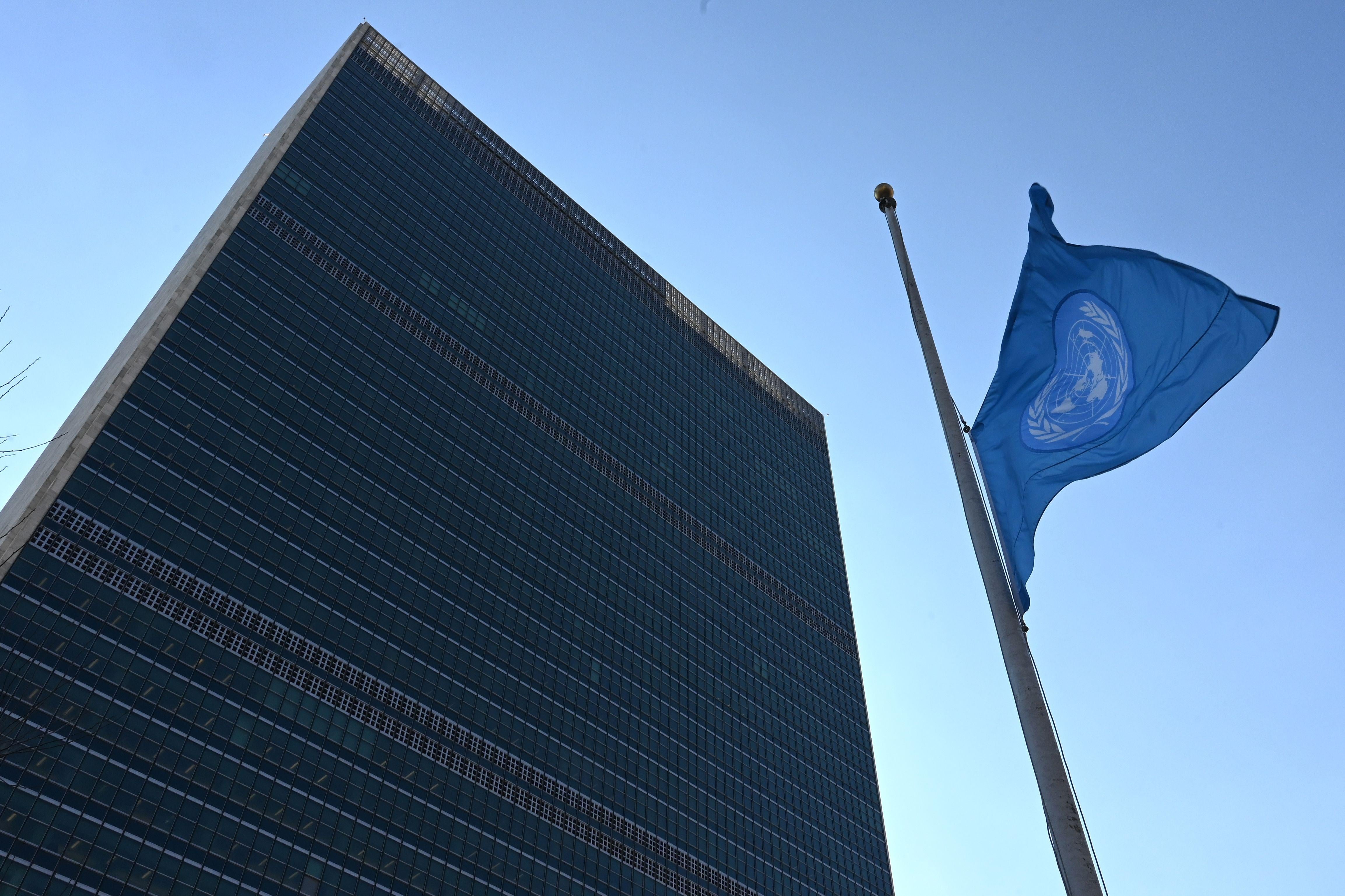 The flag of the United Nations is flown at half-mast in front of the Secretariat building.