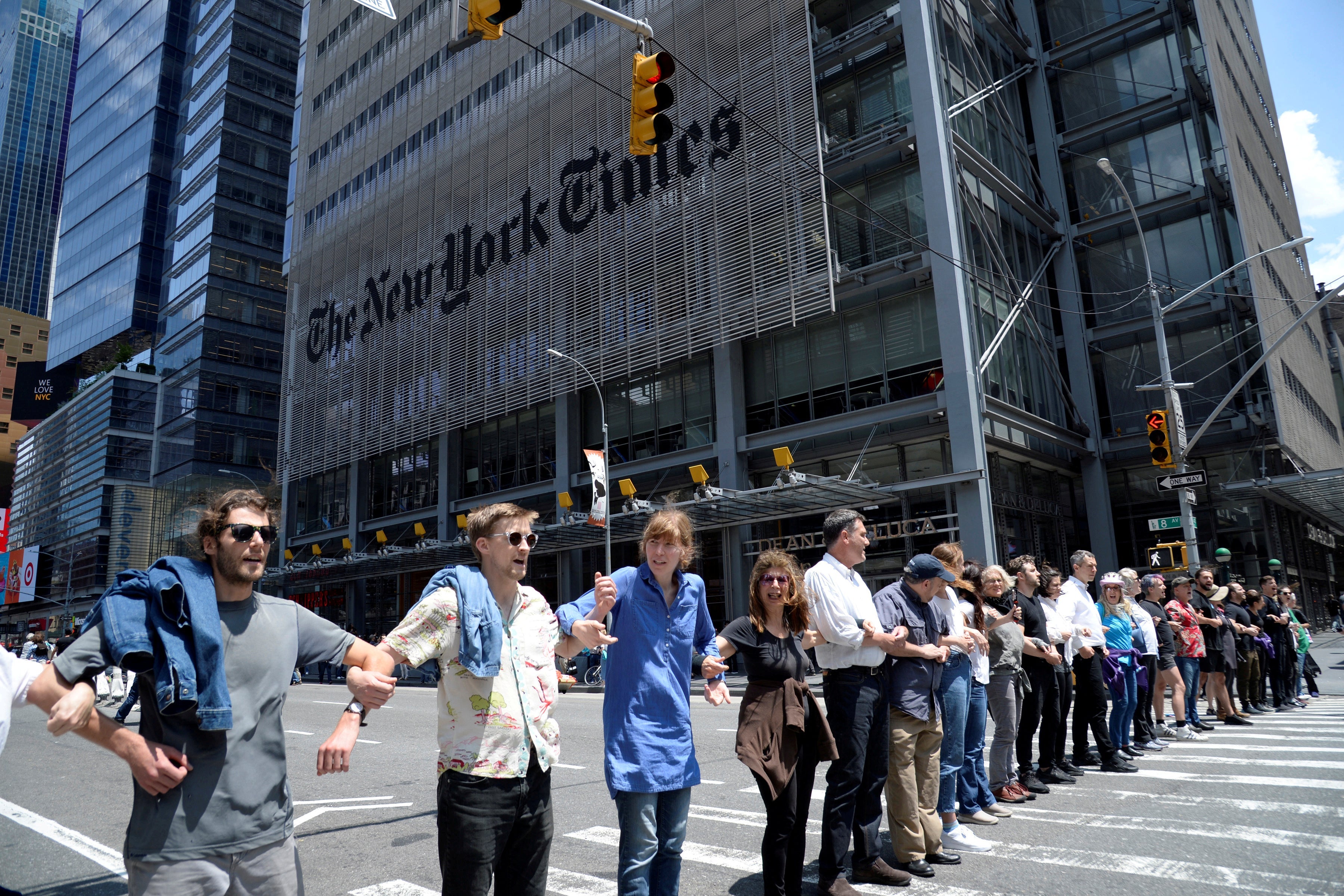 Activists from the group Extinction Rebellion block traffic on 8th Avenue in front of the New York Times building and the Port Authority Bus Terminal near Times Square in New York City on June 22, 2019. 
