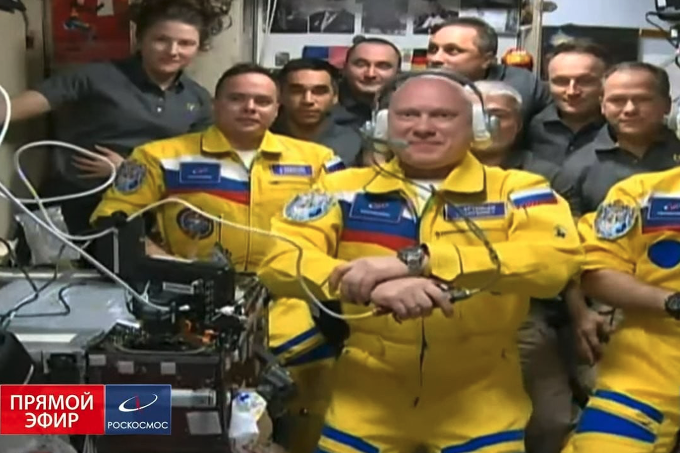 Three Russian cosmonauts Oleg Artemyev, Denis Matveev and Sergey Korsakov have arrived at the International Space Station on Friday March 18, 2022 docking their Soyuz capsule and being seen wearing flight suits in yellow and blue colors that match the Ukrainian flag. 
