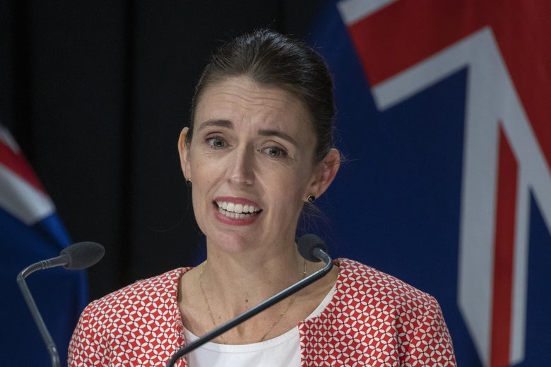 Ardern speaking at a mic