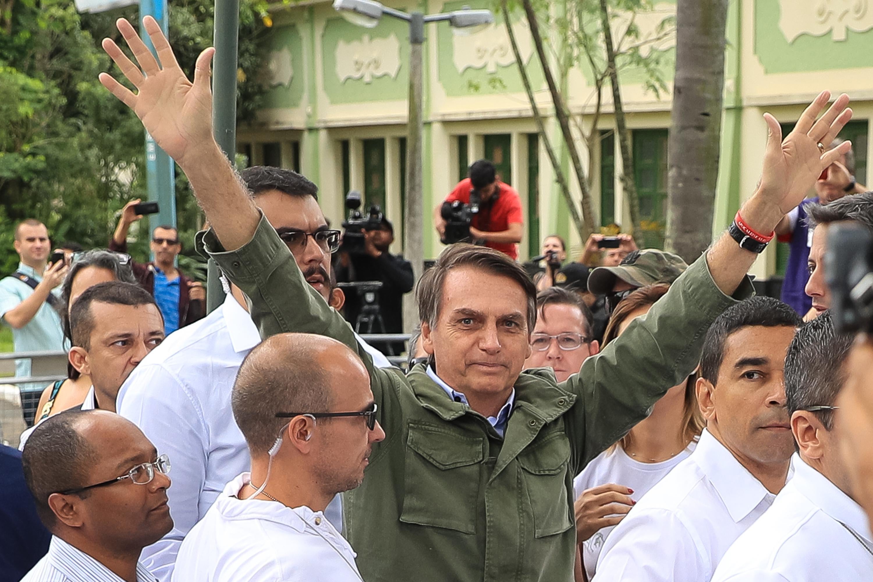 Jair Bolsonaro gestures after casting his vote during general elections on October 28, 2018 in Rio de Janeiro, Brazil. 